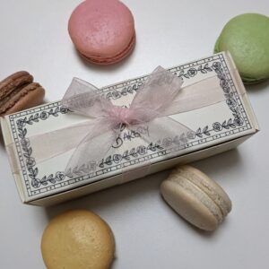 A packaged box of 5 macarons